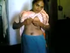 In a home movie clip, an amateur Indian white woman displays her love muffins.